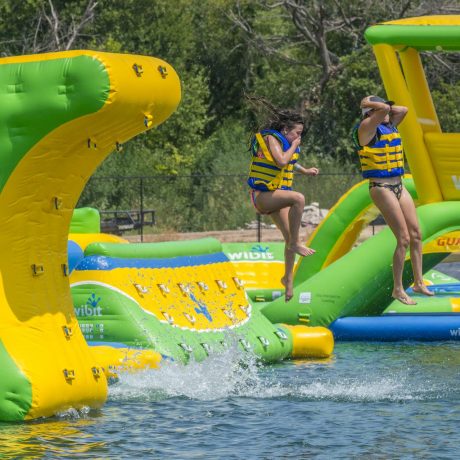 Wibit Girls Jumping into Lake Image